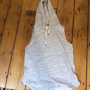 Long sweatshirt with no sleeves.